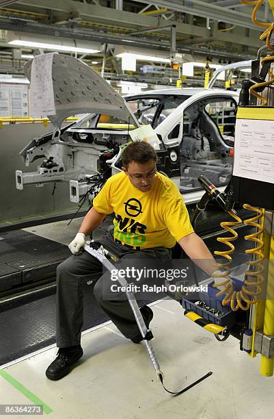 An employee of German carmaker Adam Opel GmbH works on an Opel Corsa at a plant on May 4, 2009 in Eisenach, Germany. Representatives of the German...