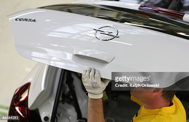 An employee of German carmaker Adam Opel GmbH works on an Opel Corsa at a plant on May 4, 2009 in Eisenach, Germany. Representatives of the German...