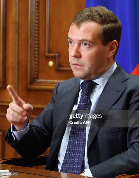 Russian President Dmitry Medvedev spaeks during his video-conversation with Tomsk region governor Viktor Kress in Moscow on May 4, 2009. AFP PHOTO /...
