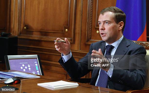Russian President Dmitry Medvedev speaks during his video-conversation with Tomsk region governor Viktor Kress in Moscow on May 4, 2009. AFP PHOTO /...