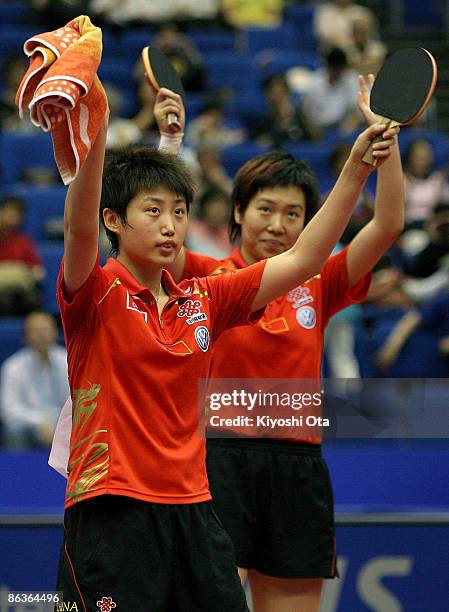 Guo Yue and Li Xiaoxia of China greet spectators as they celebrate their victory over Ding Ning and Guo Yan of China in the Women's Doubles final...