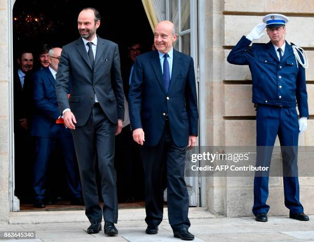 French Prime Minister Edouard Philippe shares a light moment with former Prime Minister and current Mayor of Bordeaux Alain Juppe as they walk at The...