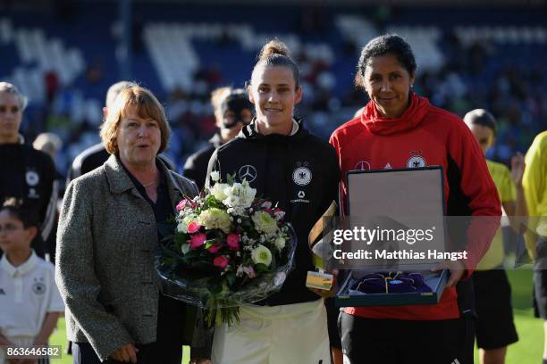 Simone Lauder is honored by DFB Vice President Hannelore Ratzeburg and Head coach Steffi Jones of Germany for their 100th national team match prior...