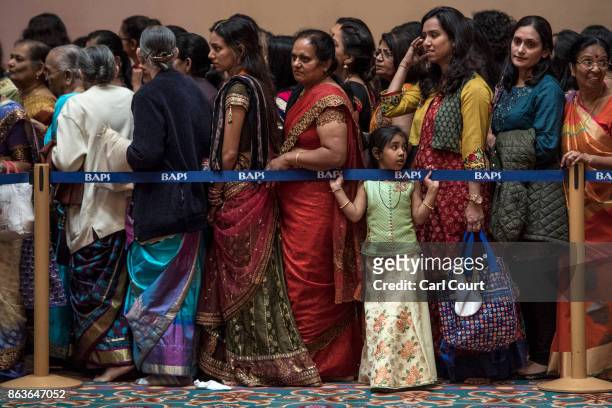 Hindu worshippers queue to pray at a shrine during Diwali celebrations at Neasden Temple on October 20, 2017 in London, England. BAPS Shri...