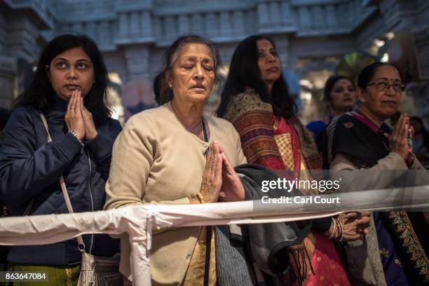 Hindu worshippers pray at a shrine during Diwali celebrations at Neasden Temple on October 20, 2017 in London, England. BAPS Shri Swaminarayan Mandir...