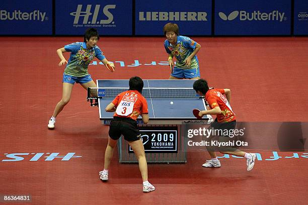 Ding Ning and Guo Yan of China compete in the Women's Doubles final match against Guo Yue and Li Xiaoxia of China during the World Table Tennis...