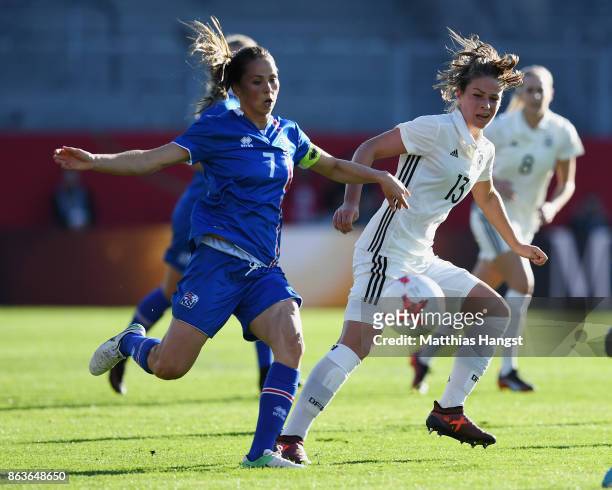 Hallbera Guony Gisladottir of Iceland and Melanie Leupolz of Germany compete for the ball during the 2019 FIFA Women's World Championship Qualifier...