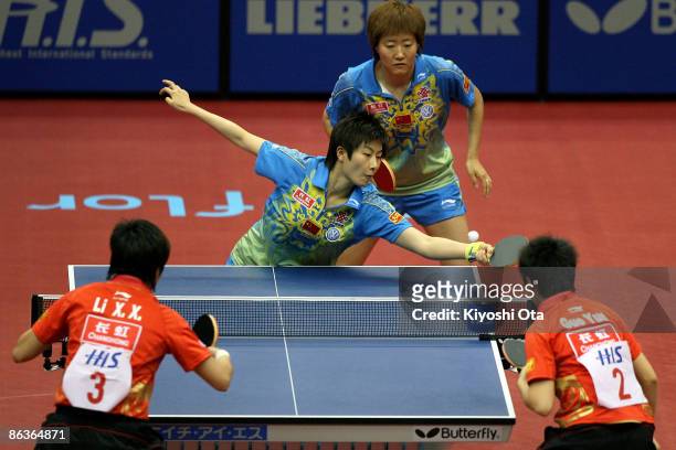 Ding Ning and Guo Yan of China compete in the Women's Doubles final match against Guo Yue and Li Xiaoxia of China during the World Table Tennis...