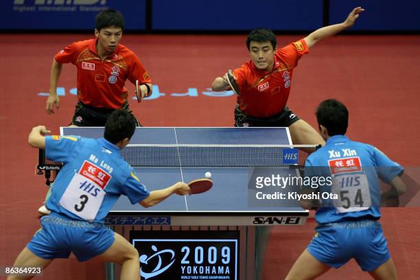 Wang Hao and Chen Qi of China compete in the Men's Doubles final match against Ma Long and Xu Xin of China during the World Table Tennis...