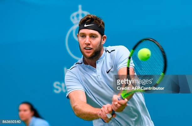 Jack Sock returns the ball to Italy's Fabio Fognini during their tennis match at the ATP Stockholm Open tournament on October 20, 2017 in Stockholm....