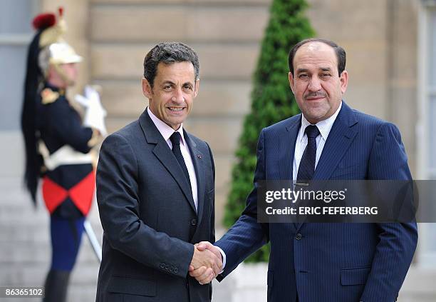French President Nicolas Sarkozy shakes hands with Iraqi Prime minister Nuri al-Maliki, on May 4 prior to a meeting, at the Elysee Presidential...