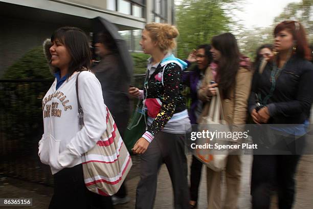 Students enter St. Francis Preparatory School as it re-opens after closure due to a swine flu outbreak May 4, 2009 in the Fresh Meadows neighborhood...