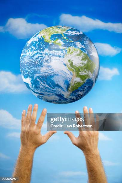 hands with earth - many hands in air stock pictures, royalty-free photos & images