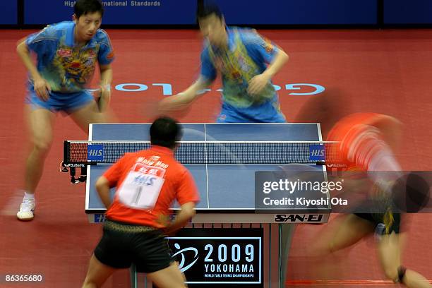 Ma Long and Xu Xin of China compete in the Men's Doubles final match against Wang Hao and Chen Qi of China during the World Table Tennis...