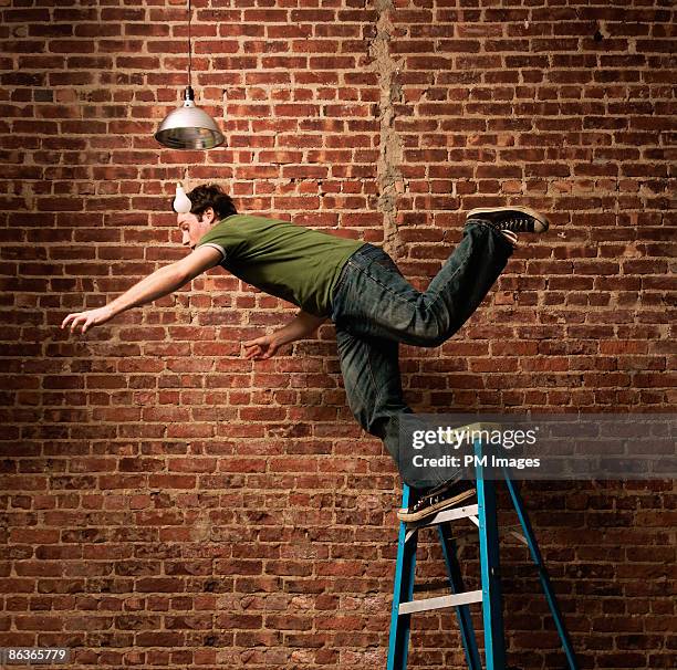 man falling from ladder - ignorance foto e immagini stock