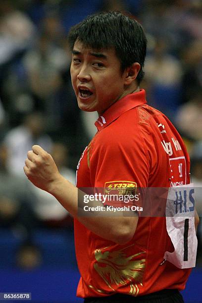 Wang Hao of China reacts after scoring a point in the Men's Singles semi final match against Ma Long of China during the World Table Tennis...