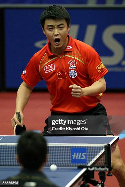 Wang Hao of China reacts after scoring a point in the Men's Singles semi final match against Ma Long of China during the World Table Tennis...