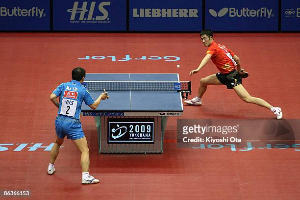 Wang Liqin of China and Ma Lin of China compete in the Men's Singles semi final match during the World Table Tennis Championships 2009 at Yokohama...