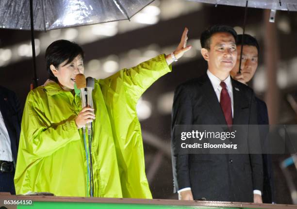 Yuriko Koike, governor of Tokyo and leader of the Party of Hope, left, gestures while speaking as she stands next to Seiji Maehara, leader of the...