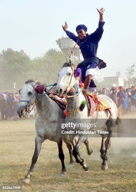 Nihang Singh performs his martial art skills on the occasion of Bandi Chhor Divas, on October 20, 2017 in Amritsar, India. Bandi Chhor Divas is a...