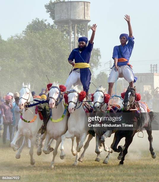 Nihang Singh performs his martial art skills on the occasion of Bandi Chhor Divas, on October 20, 2017 in Amritsar, India. Bandi Chhor Divas is a...