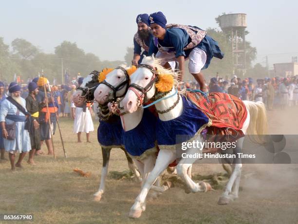 Nihang Singh performs his martial art skills on the occasion of Bandi Chhor Divas, on October 20, 2017 in Amritsar, India. Bandi Chhor Divas is a...