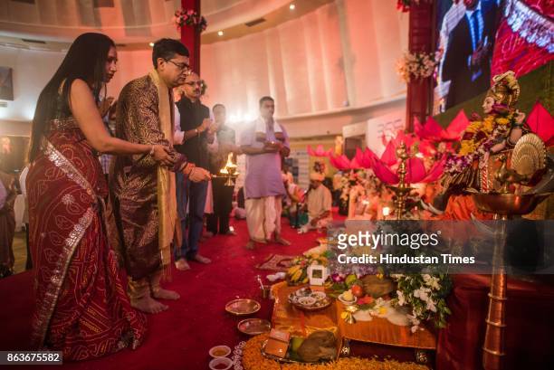 And CEO Ashishkumar Chauhan performs rituals during Lakshmi Pujan on the occasion of Diwali, at the Bombay Stock Exchange , on October 19, 2017 in...