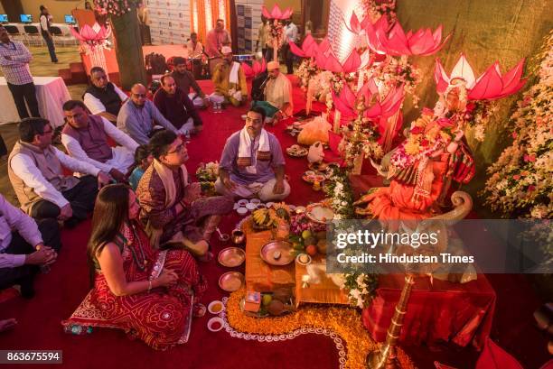 And CEO Ashishkumar Chauhan performs rituals during Lakshmi Pujan on the occasion of Diwali, at the Bombay Stock Exchange , on October 19, 2017 in...