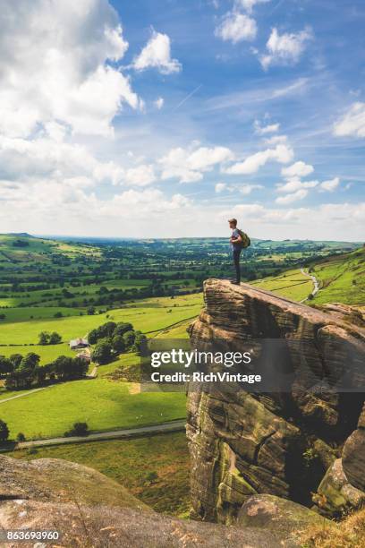 teenage boy stands at edge in peak district - peak district national park stock pictures, royalty-free photos & images