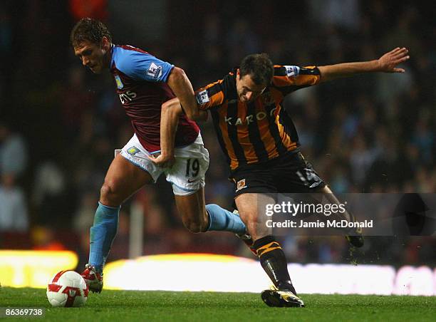 Stiliyan Petrov of Aston Villa battles for the ball with Richard Garcia of Hull City during the Barclays Premier League match between Aston Villa and...