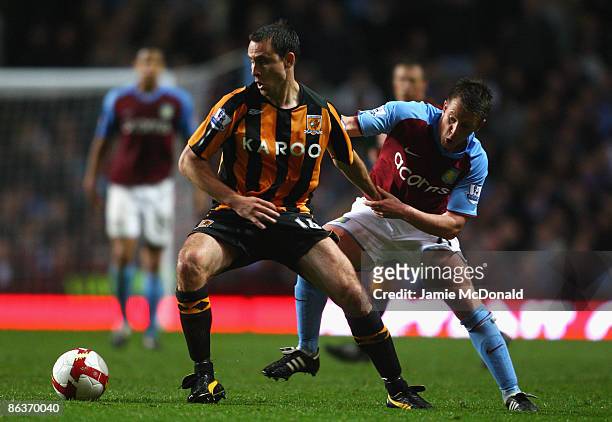 Nicky Shorey of Aston Villa tangles with Richard Garcia of Hull City during the Barclays Premier League match between Aston Villa and Hull City at...