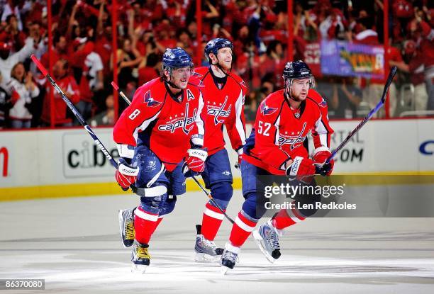 Alex Ovechin, Brooks Laich and Mike Green of the Washington Capitals all celebrate Ovechkin's go-ahead goal in the first period against the...