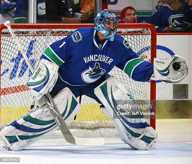 Roberto Luongo of the Vancouver Canucks makes a glove save during Game Two of the Western Conference Semifinal Round of the 2009 Stanley Cup Playoffs...