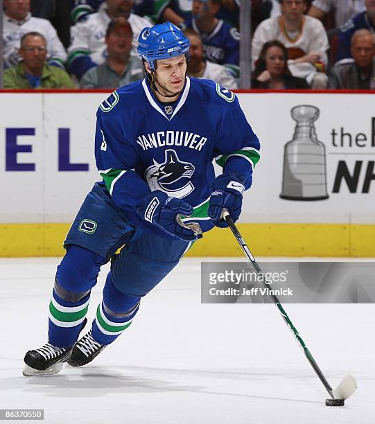 Kevin Bieksa of the Vancouver Canucks skates up ice with the puck during Game Two of the Western Conference Semifinal Round of the 2009 Stanley Cup...