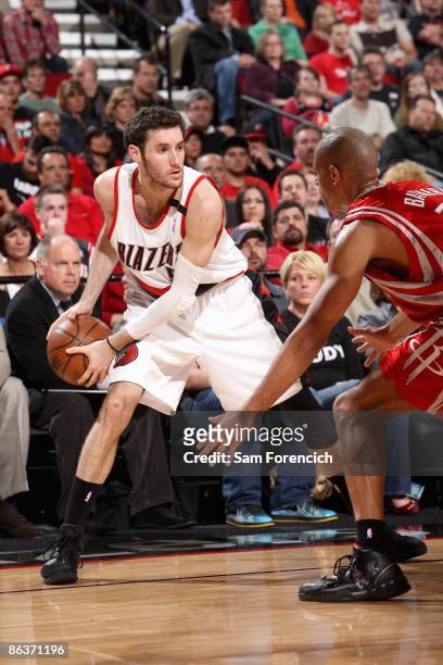 Rudy Fernandez of the Portland Trail Blazers looks to maneuver against Shane Battier of the Houston Rockets in Game Five of the Western Conference...