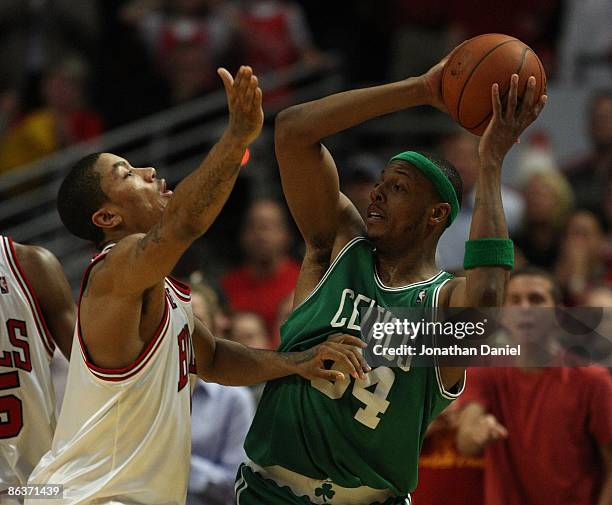 Paul Pierce of the Boston Celtics looks to pass under pressure from Derrick Rose of the Chicago Bulls in Game Six of the Eastern Conference...