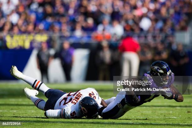 Wide Receiver Chris Matthews of the Baltimore Ravens is tackled by inside linebacker Christian Jones of the Chicago Bears during the fourth quarter...