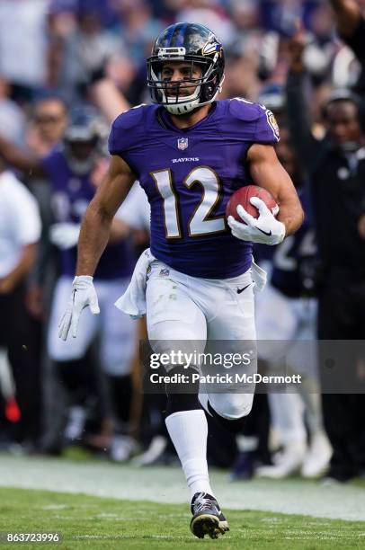 Wide Receiver Michael Campanaro of the Baltimore Ravens returns a punt for a touchdown in the fourth quarter against the Chicago Bears at M&T Bank...