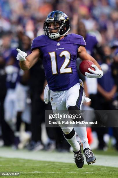 Wide Receiver Michael Campanaro of the Baltimore Ravens returns a punt for a touchdown in the fourth quarter against the Chicago Bears at M&T Bank...