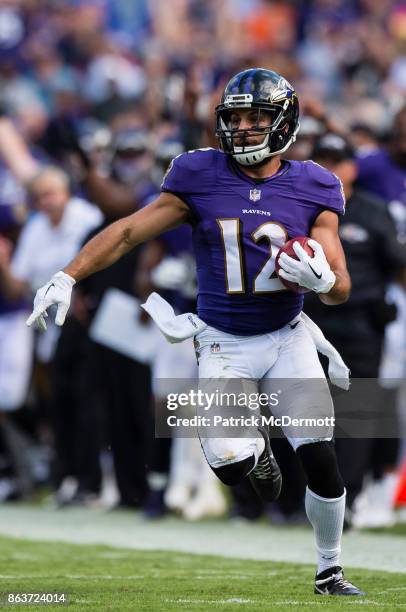 Wide Receiver Michael Campanaro of the Baltimore Ravens returns a punt for a touchdown in the fourth quarter against the Chicago Bears at M&T Bank...