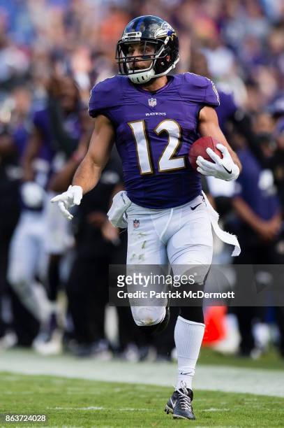 Wide Receiver Michael Campanaro of the Baltimore Ravens returns a punt for a touchdown in the fourth quarter against the Chicago Bears at M&T Bank...