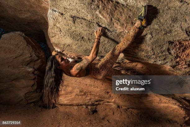 woman practicing boulder rock climbing - soloing stock pictures, royalty-free photos & images