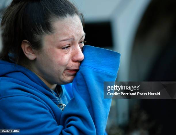 Victoria Cann wipes tears from her eyes after losing her dog in a fire on Island Avenue in Sanford on Thursday, Oct. 19, 2017. Cann, who lived on the...