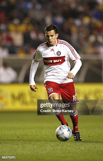 Marco Pappa of the Chicago Fire moves the ball up the field during the second half against Club America at Toyota Park on April 29, 2009 in...