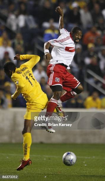 Dasan Robinson of the Chicago Fire and Robert de Pinho of Club America go up for a header at Toyota Park on April 29, 2009 in Bridgeview, Illinois....