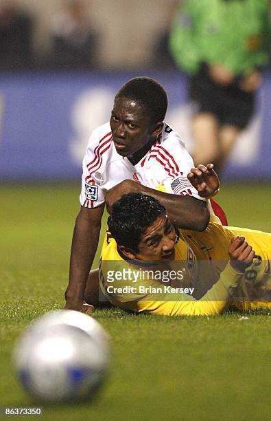 Patrick Nyarko of the Chicago Fire collides with Ademar Rodriguez of Club America during the first half at Toyota Park on April 29, 2009 in...