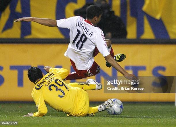 Guillermo Cerda of Club America takes out Mike Banner of the Chicago Fire during the first half at Toyota Park on April 29, 2009 in Bridgeview,...