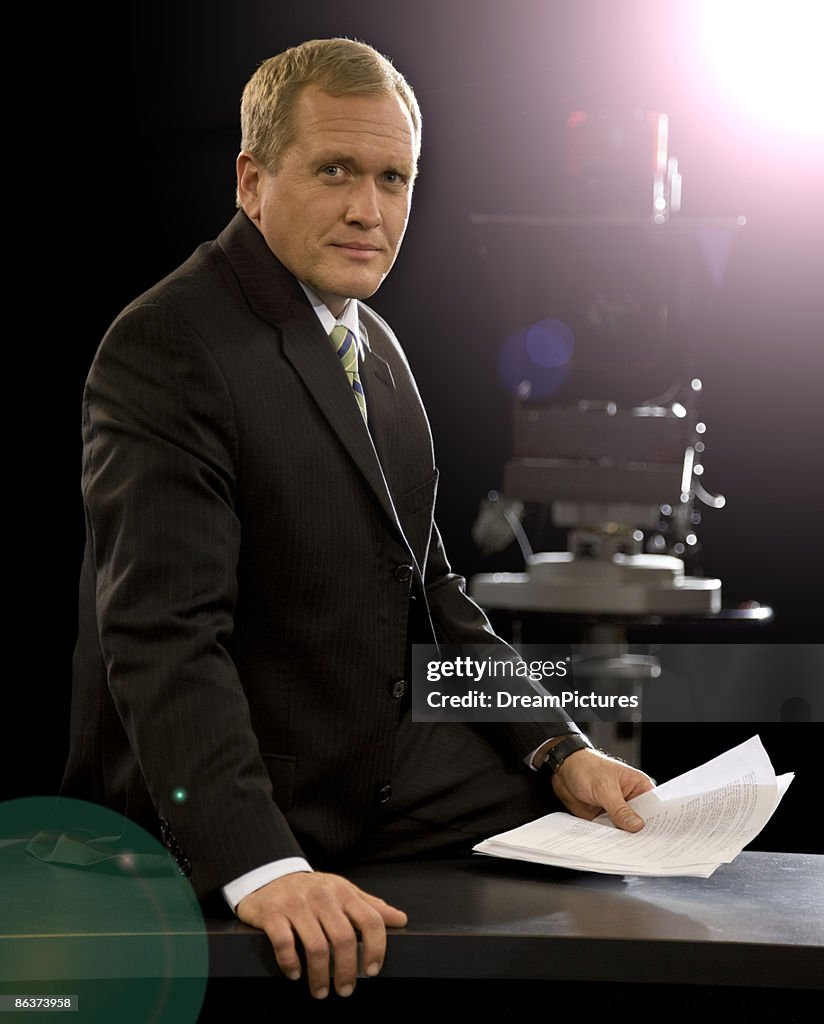 Portrait of male newscaster