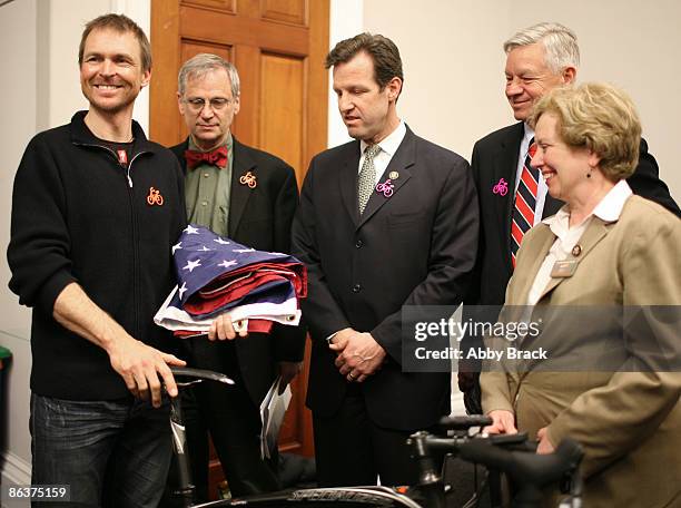 Representatives Earl Blumenauer, Russ Carnahan, Tom Petri and Mary Jo Kilroy present a United State Flag to Phil Keoghan after he spoke about his...