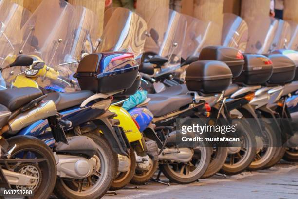 motorcycles parked in a row - marble stone yellow red stock pictures, royalty-free photos & images